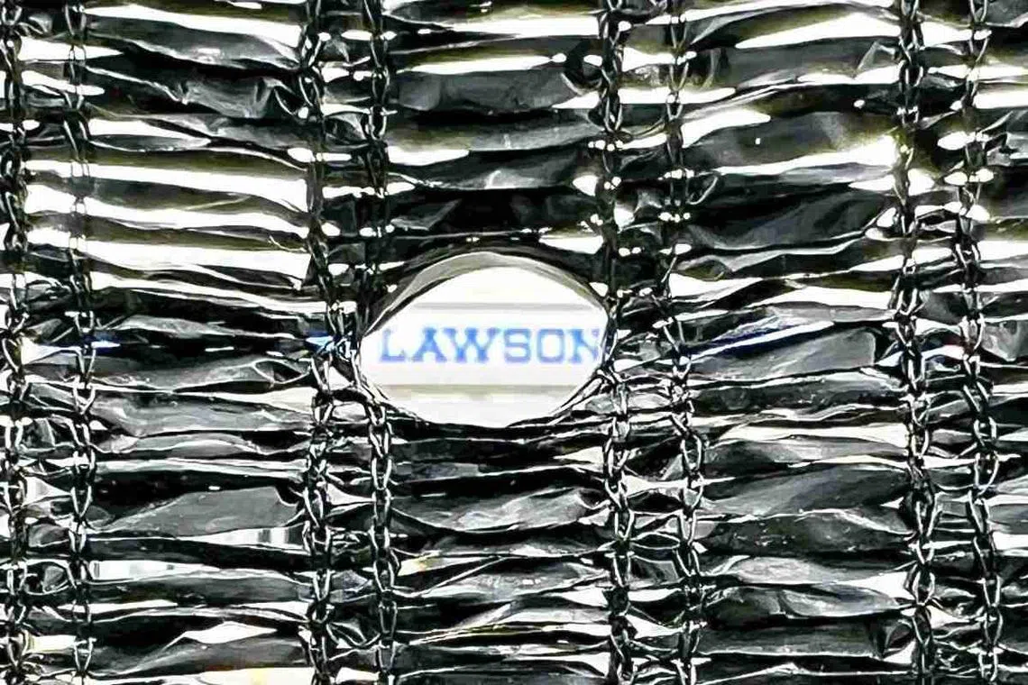 Several holes, about 1cm in diameter, were made in the black mesh screen installed nearby the Kawaguchiko-ekimae Lawson store in Yamanashi Prefecture, Japan. 