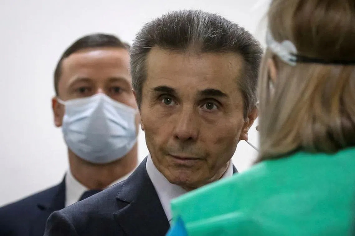 FILE PHOTO: Bidzina Ivanishvili, Georgia's former prime minister, stands at a polling station during a municipal election in Tbilisi, Georgia, October 2, 2021.  REUTERS/Irakli Gedenidze/File Photo