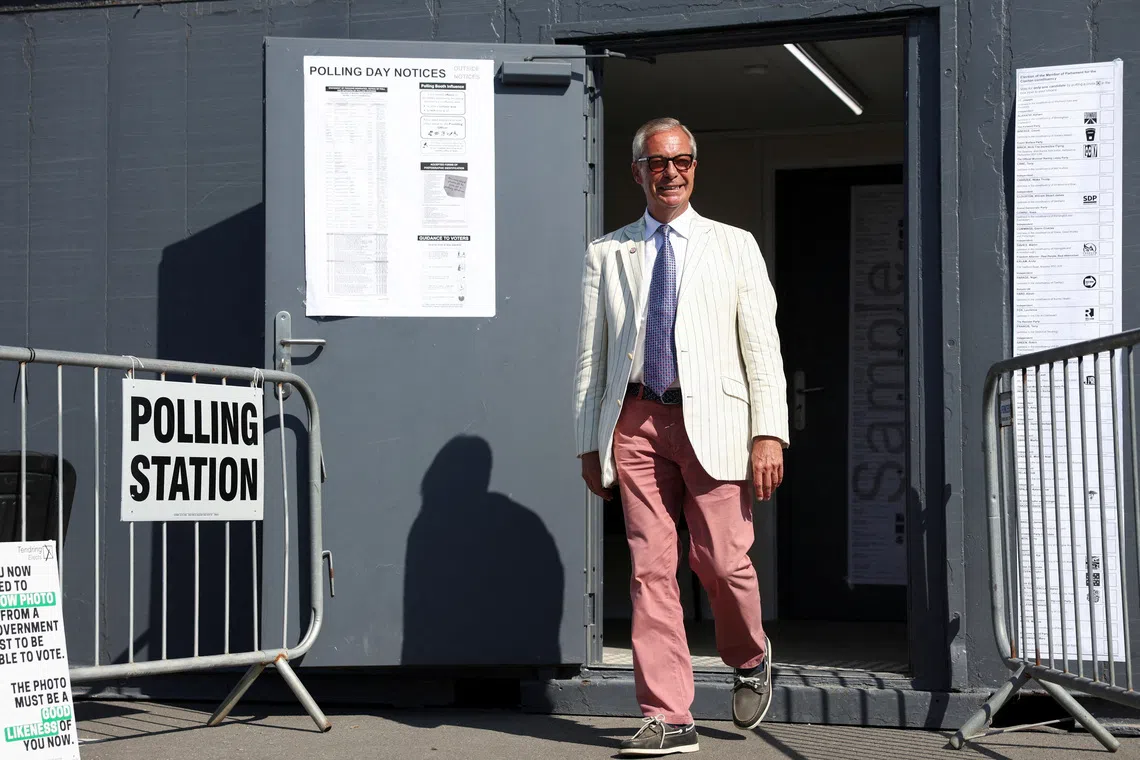 A man in a white jacket and pink trousers exits a polling station.