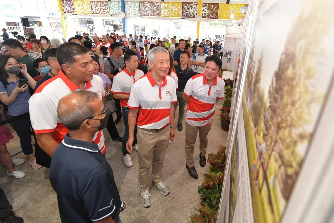 PM Lee Hsien Loong touring an exhibition showcasing the amenities and facilities in Ang Mo Kio that will be redesigned and upgraded.