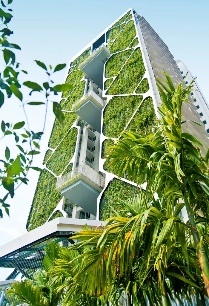 benefits of sustainability in business, vertical garden of native trees and plants at city developments limited’s tree house condominium, designed to protect biodiversity and cool the building by up to 3 deg c