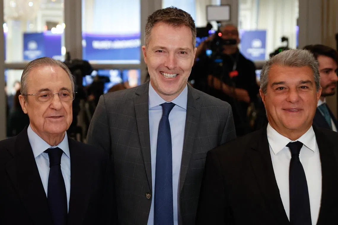(From left) Real Madrid president Florentino Perez, A22 Sports Management CEO Bernd Reichart and Barcelona chief Joan Laporta seen during a briefing breakfast organised by the New Economy Forum under the title "Super League in the future of European soccer", in Madrid on Friday.