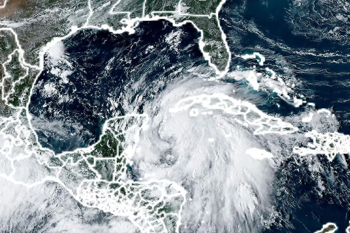 This handout satellite image courtesy of the National Oceanic and Atmospheric Administration (NOAA) and the Regional and Mesoscale Meteorology Branch (RAMMB) shows hurricane Helene churning over the Caribbean on September 24, 2024. The US state of Florida on September 24, 2024 was preparing for the arrival of Storm Helene, due to make landfall later in the week as a powerful Category 3 hurricane. (Photo by NOAA / AFP) / RESTRICTED TO EDITORIAL USE - MANDATORY CREDIT "AFP PHOTO / NOAA / RAMMB"  - NO MARKETING NO ADVERTISING CAMPAIGNS - DISTRIBUTED AS A SERVICE TO CLIENTS