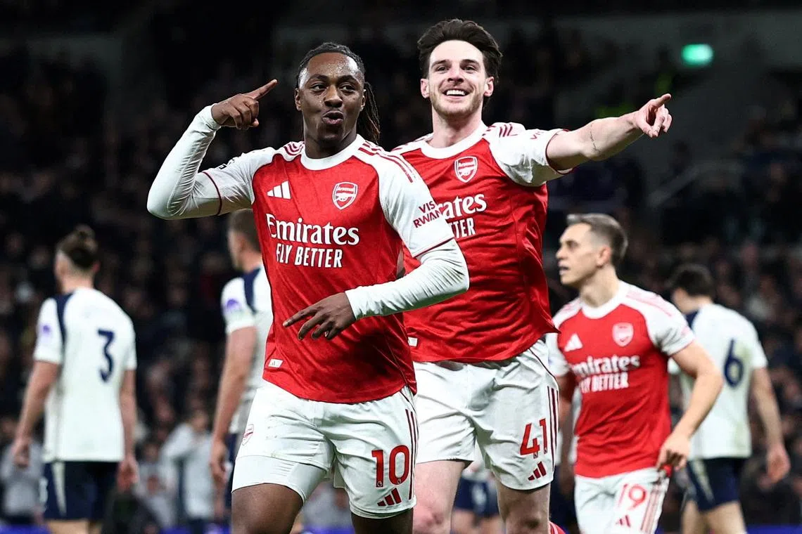 Soccer Football - Premier League - Tottenham Hotspur v Arsenal - Tottenham Hotspur Stadium, London, Britain - February 22, 2026 Arsenal's Eberechi Eze celebrates scoring their third goal with Declan Rice REUTERS/David Klein