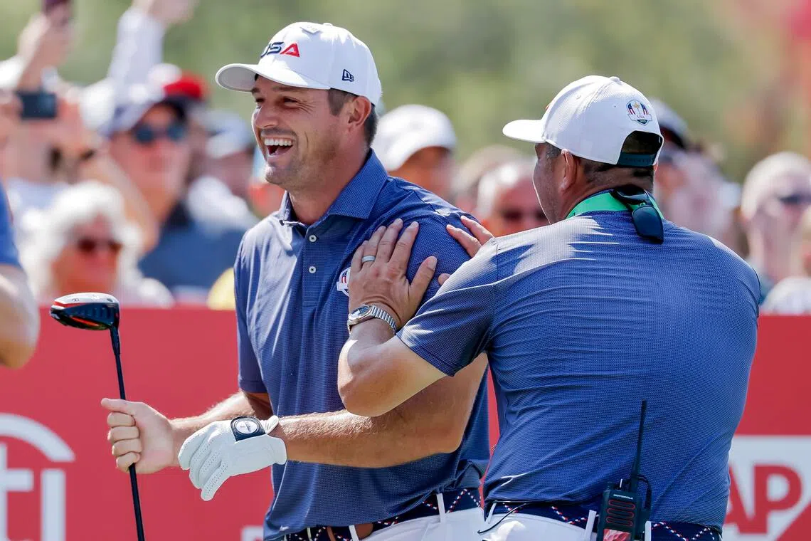 Bryson DeChambeau (left) of the US reacts with US vice-captain Gary Woodland (after hitting a tee shot on the 15th hole during practice for the 2025 Ryder Cup golf tournament at the Bethpage Black Golf Course in Farmingdale, New York, on Sept 23, 2025. 
