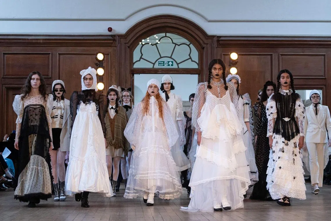 Models present creations for London-based Turkish designer Bora Aksu at London Fashion Week on Feb 17.
