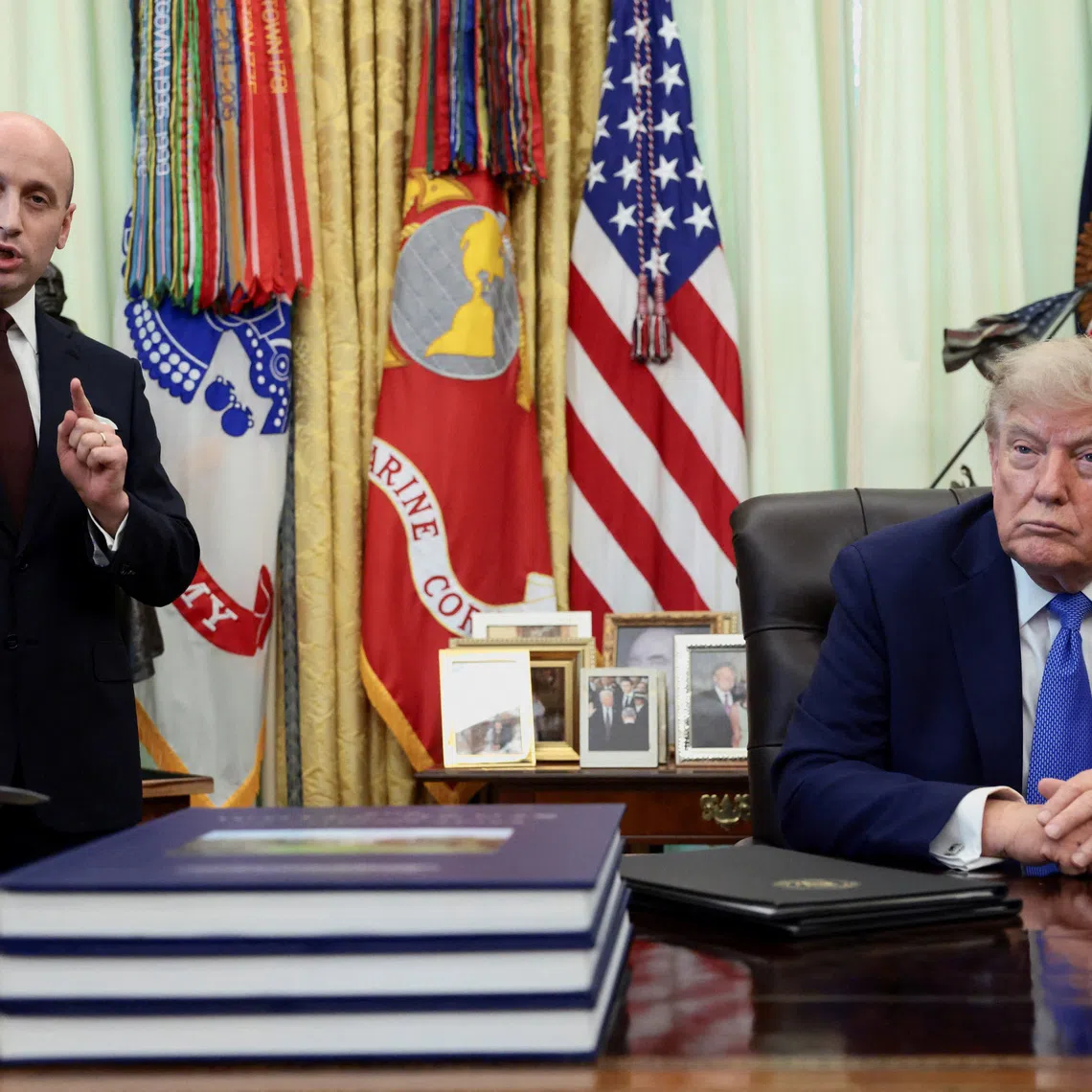 White House Deputy Chief of Staff Stephen Miller speaks while U.S. President Donald Trump listens during an event to sign executive orders related to birthright citizenship and the polysilicon industry, in the Oval Office at the White House in Washington, D.C., U.S., August 6, 2026. REUTERS/Evelyn Hockstein