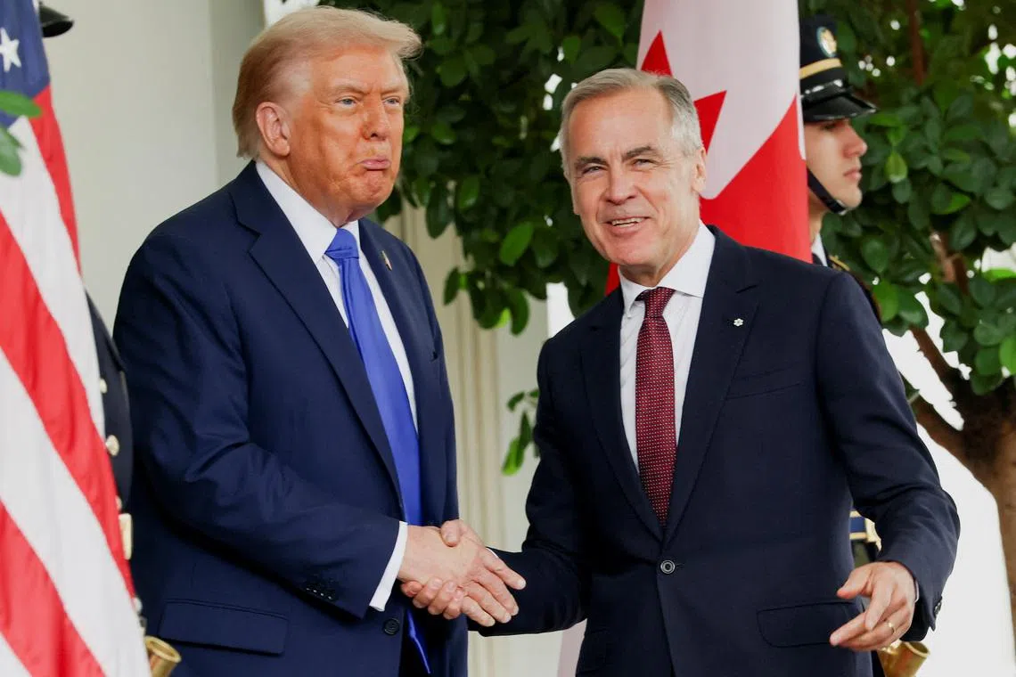 U.S. President Donald Trump welcomes Canada's Prime Minister Mark Carney at the White House in Washington, D.C., U.S., October 7, 2025. REUTERS/Evelyn Hockstein