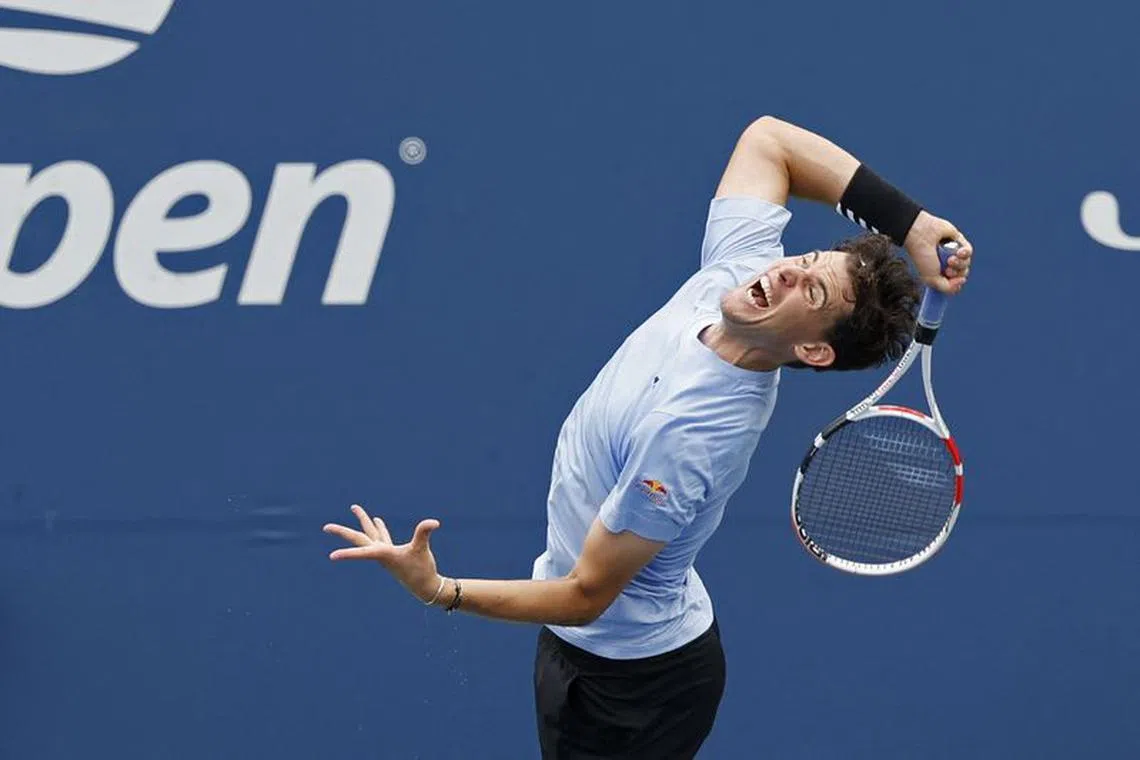 Aug 28, 2023; Flushing, NY, USA; Dominic Thiem of Austria serves against Alexander Bublik of Kazakhstan (not pictured) on day one of the 2023 US Open at the Billie Jean King National Tennis Center. Mandatory Credit: Geoff Burke-USA TODAY Sports