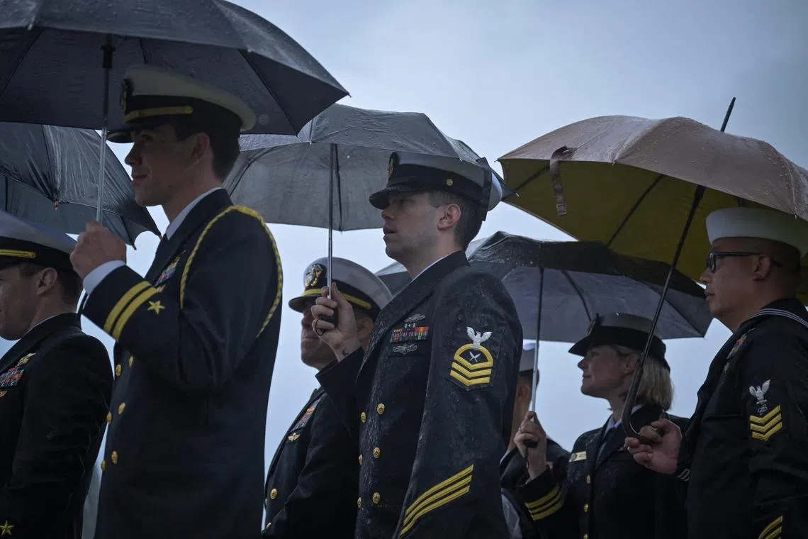 Soldiers attend a ceremony dedicating a new monument to US navy and army units that stormed Omaha Beach during the D-Day landings in 1944.