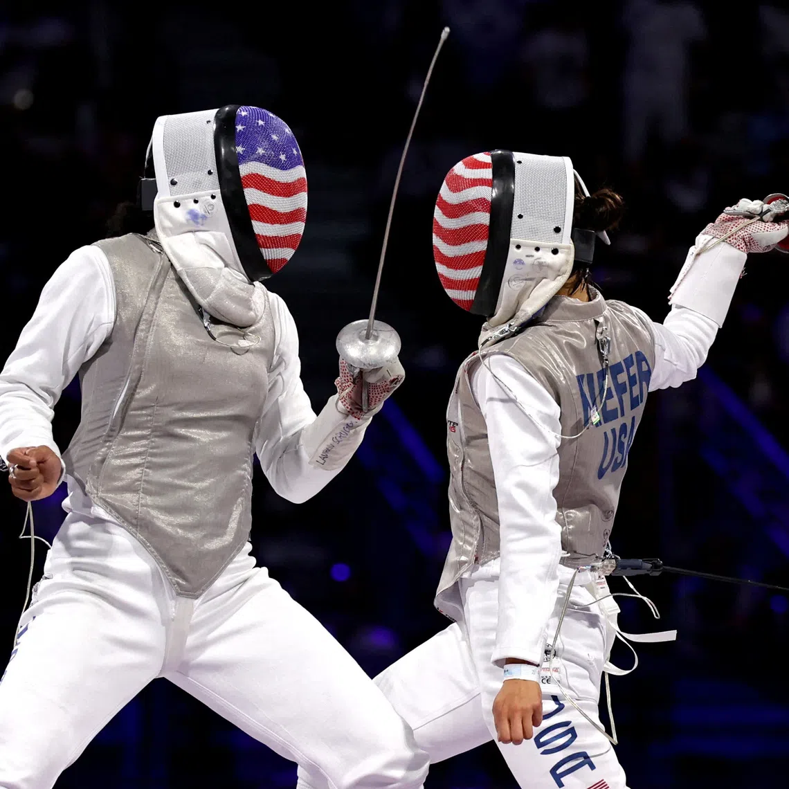 FILE PHOTO: Paris 2024 Olympics - Fencing - Women's Foil Individual Gold Medal Bout - Grand Palais, Paris, France - July 28, 2024. Lee Kiefer of United States in action with Lauren Scruggs of United States. REUTERS/Maye-E Wong/File Photo