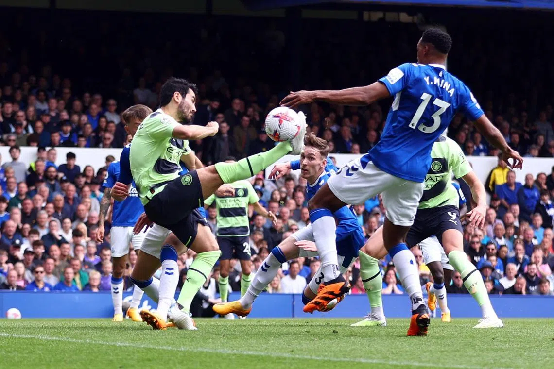 Manchester City's Ilkay Gundogan scoring their first goal against Everton in a Premier League clash on Sunday.
