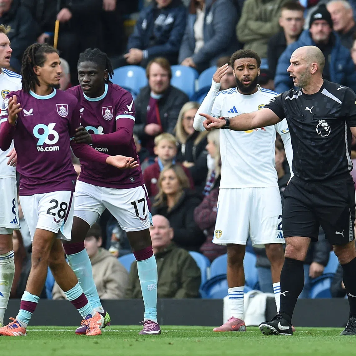 FILE PHOTO: Soccer Football - Premier League - Burnley v Leeds United - Turf Moor, Burnley, Britain - October 18, 2025 Burnley's Hannibal Mejbri remonstrates with referee Tim Robinson REUTERS/Peter Powell