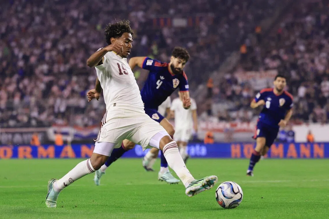 Spain’s Lamine Yamal in action (left) with Croatia’s Josko Gvardiol on Oct 6.