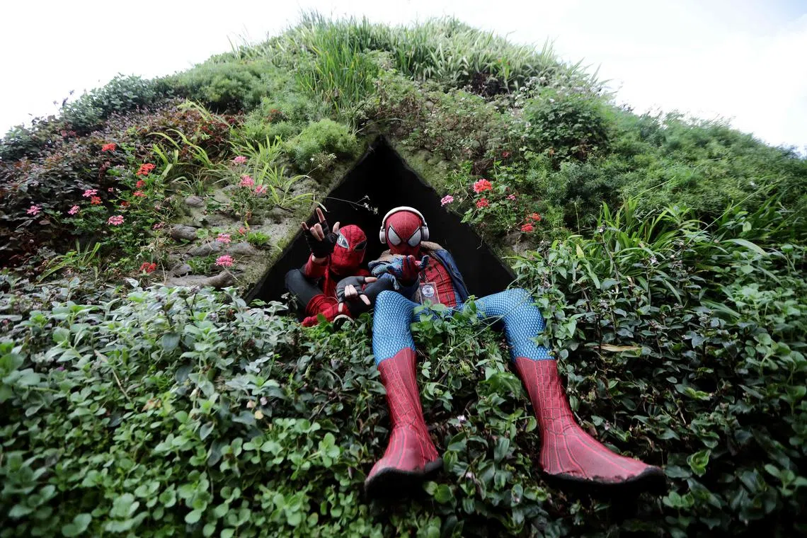 Cosplayers dressed as Spiderman gathering at the obelisk in an attempt to break the world record for people dressed up as the comic character in one place in Buenos Aires on October 29, 2023. 