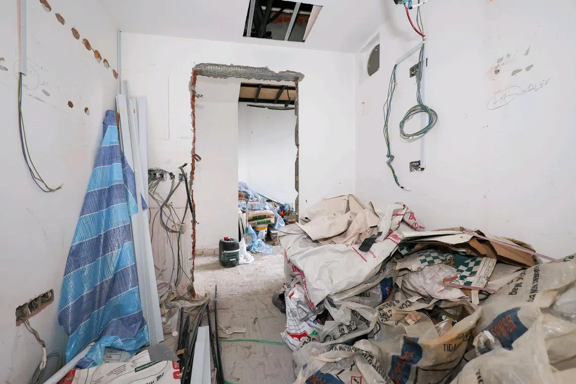 ST20241114_202478400523/ilreno/Brian Teo/Isabelle Liew BX/Interior of the kitchen in Mr W's partially renovated condominium penthouse on Nov 14, 2024. He paid over $150,000 to Renosaves Project, a renovation firm, only for them to take off with the money after completing minimal works such as hacking. ST PHOTO: BRIAN TEO
