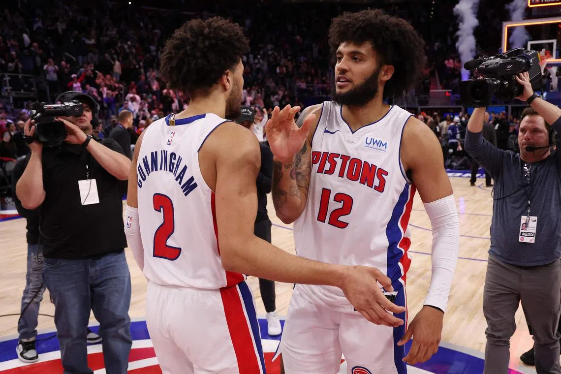 Cade Cunningham and Isaiah Livers of the Detroit Pistons reacting to a 129-127 win over the Toronto Raptors at Little Caesars Arena on Dec 30. It ended a record 28-game losing run.
