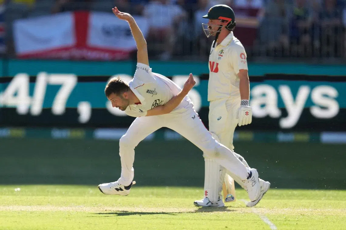 FILE PHOTO: Cricket - The Ashes - Australia v England - First Test - Perth Stadium, Perth, Australia - November 21, 2025 England's Mark Wood in action REUTERS/Asanka Brendon Ratnayake/File Photo