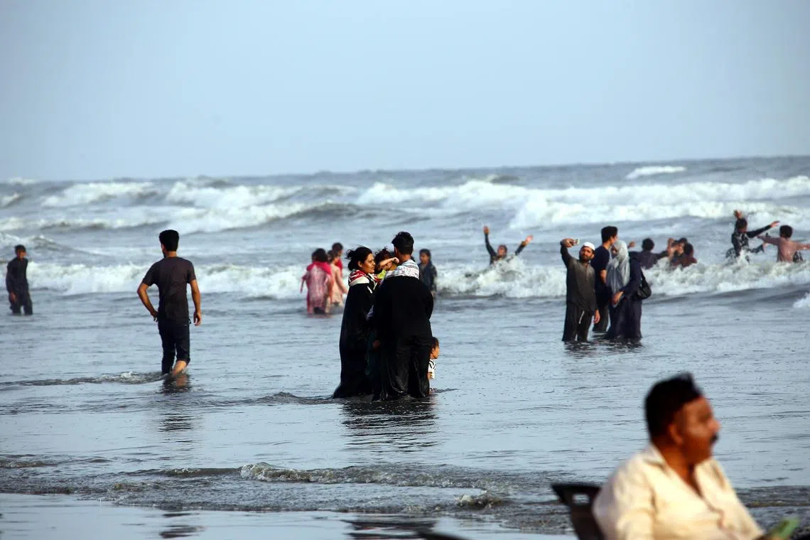 People cool off in the Arabian Sea during a heatwave in Karachi, Pakistan, on May 24, 2025.
