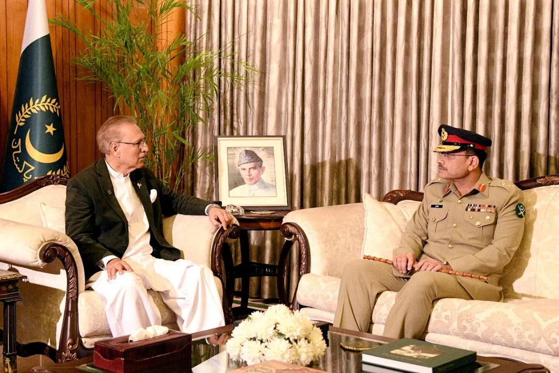 FILE PHOTO: Lieutenant General Asim Munir, who was appointed as the new Chief Of Army Staff (COAS) of Pakistan, meets with President of Pakistan Arif Alvi, at the President House in Islamabad, Pakistan November 24, 2022. Press Information Department (PID)/Handout via REUTERS/File Photo