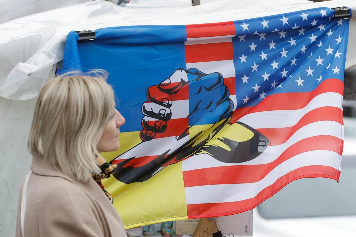 epa11705042 A Ukrainian woman passes a souvenir stall with a flag depicting Ukrainian and US flags, in downtown Kyiv, Ukraine, 06 November 2024, amid the Russian invasion. US Republican presidential candidate Donald J. Trump has been elected the 47th president of the United States after having secured more than the 270 Electoral College votes necessary, following a tightly contested race with Democratic presidential candidate US Vice President Kamala Harris.  EPA-EFE/SERGEY DOLZHENKO