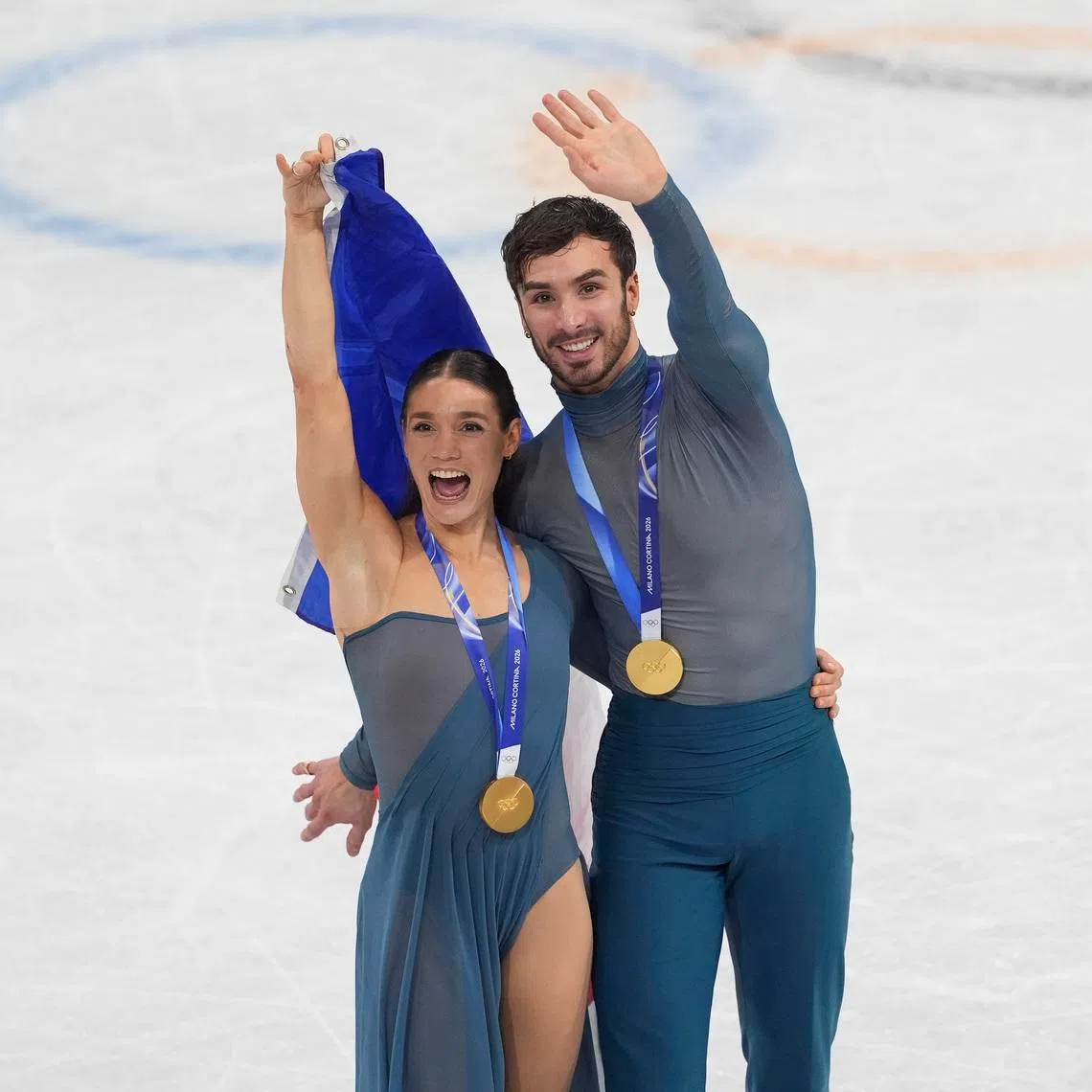 Feb 11, 2026; Milan, Italy; Laurence Fournier Beaudry and Guillaume Cizeron of France skate after receiving their medals during the Milano Cortina 2026 Olympic Winter Games at Milano Ice Skating Arena. Mandatory Credit: Amber Searls-Imagn Images