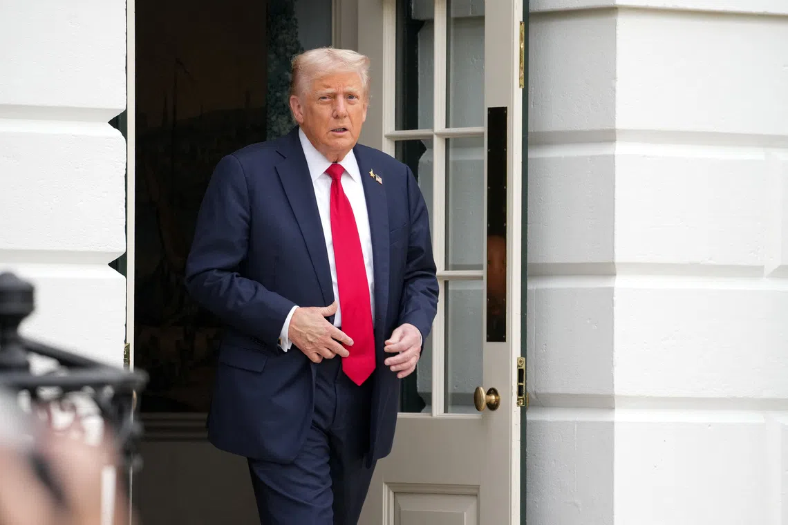 U.S. President Donald Trump walks out to board Marine One to depart for Quantico, Virginia, from the South Lawn at the White House in Washington, D.C., U.S., September 30, 2025. REUTERS/Ken Cedeno