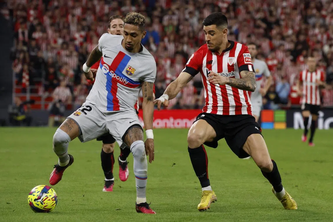 Barcelona's Raphinha (left) in action with Athletic Bilbao's Yuri Berchiche during the match in Spain on march 12, 2023.