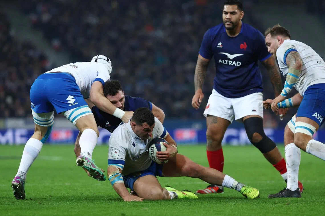 Italy's Giosue Zilocchi and Manuel Zuliani in action with France's Charles Ollivon.