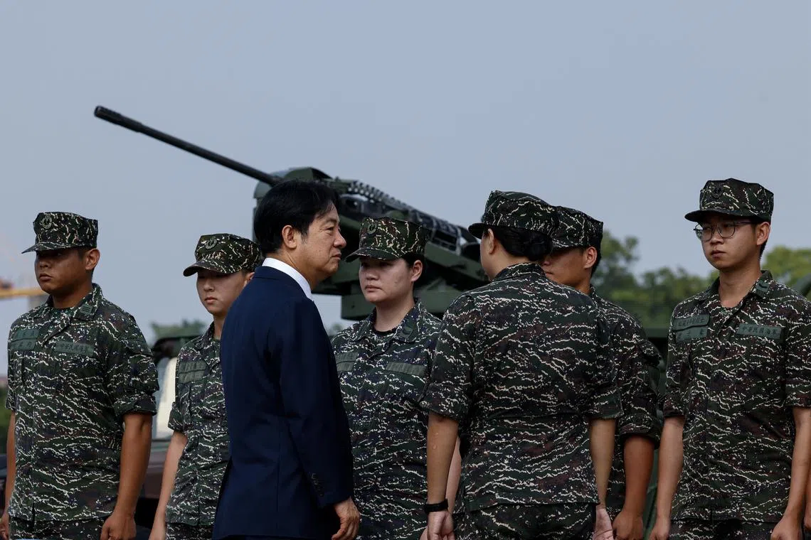 Taiwanese President Lai Ching-te visits a military base in response to recent Chinese military drills, in Taoyuan, Taiwan October 18, 2024. REUTERS/Tyrone Siu