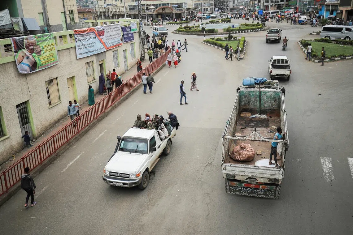 FILE PHOTO: Members of the Amhara Militia patrol on the streets in Dessie town, Amhara Region, Ethiopia, October 9, 2021. Picture taken October 9, 2021. REUTERS/Tiksa Negeri/File Photo