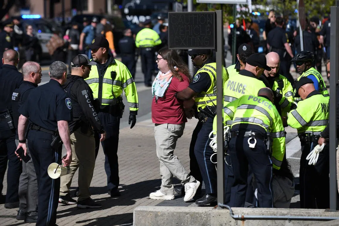 Police detain pro-Palestinian protesters as they block the entrance to the Stata Center parking garage at MIT while demanding the university divest from Israel, among other demands, in Cambridge, Massachusetts, U.S. May 9, 2024. REUTERS/Nicholas Pfosi