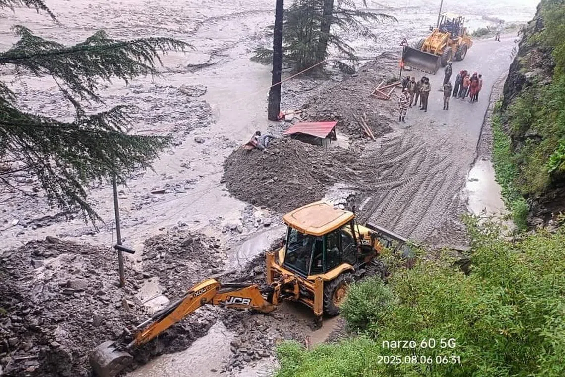 Scores of people are missing after water and debris tore down a narrow mountain valley, smashing into the town of Dharali in Uttarakhand state on Aug 5.