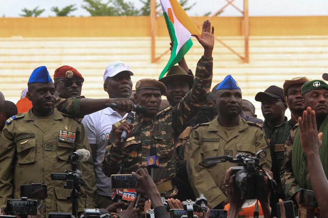 FILE PHOTO: Colonel Ibro Amadou delivers a message as he stands with other Nigerien junta leaders while Nigeriens gather one month since coup, in support of the putschist soldiers and to demand French ambassador to leave, in the capital Niamey, Niger August 26, 2023. REUTERS/Mahamadou Hamidou