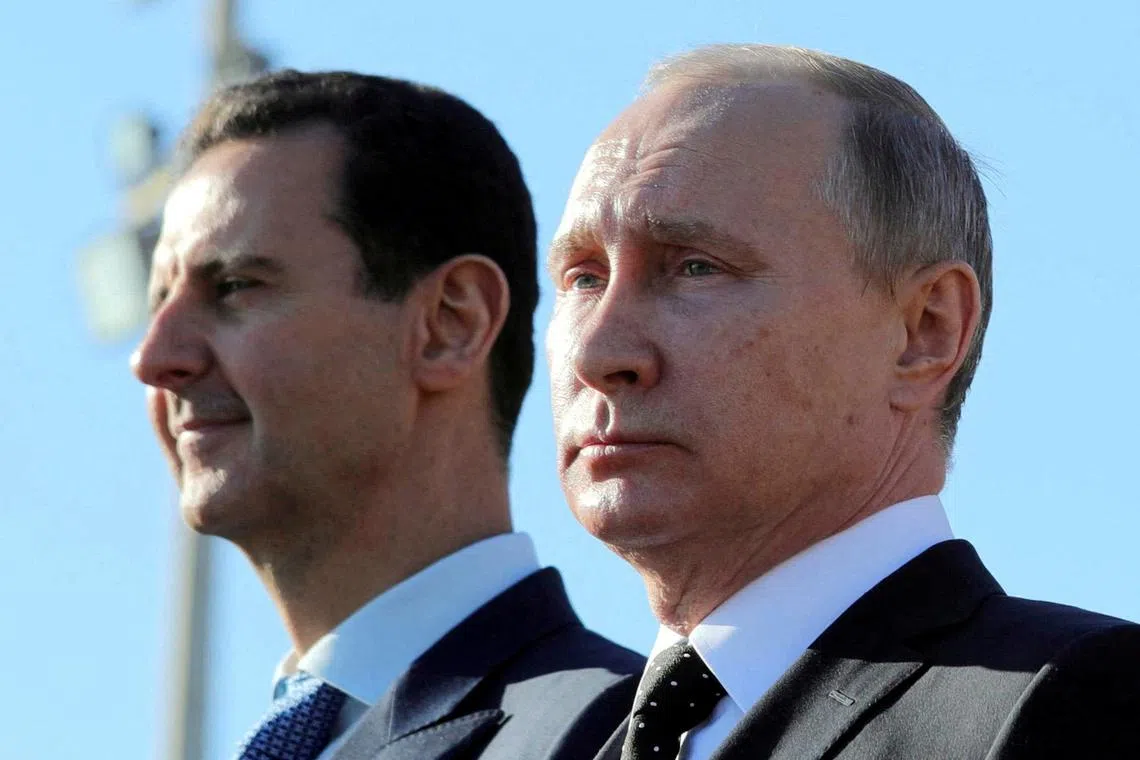 FILE PHOTO: Russian President Vladimir Putin (R) and Syrian President Bashar al-Assad visit the Hmeymim air base in Latakia Province, Syria December 11, 2017. Sputnik/Mikhail Klimentyev/ via REUTERS/File Photo