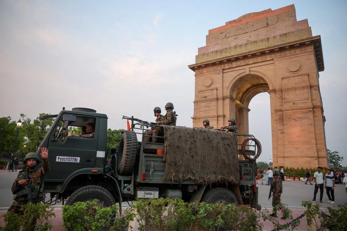 Military personnel with Indian Army stand guard at India Gate in New Delhi, India, May 8, 2025. REUTERS/Anushree Fadnavis