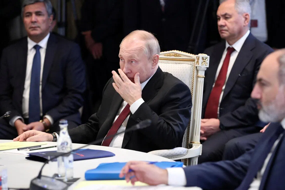Russian President Vladimir Putin (centre) and Armenian Prime Minister Nikol Pashinyan (right) attend an expanded meeting of the Russian-led alliance in Yerevan.