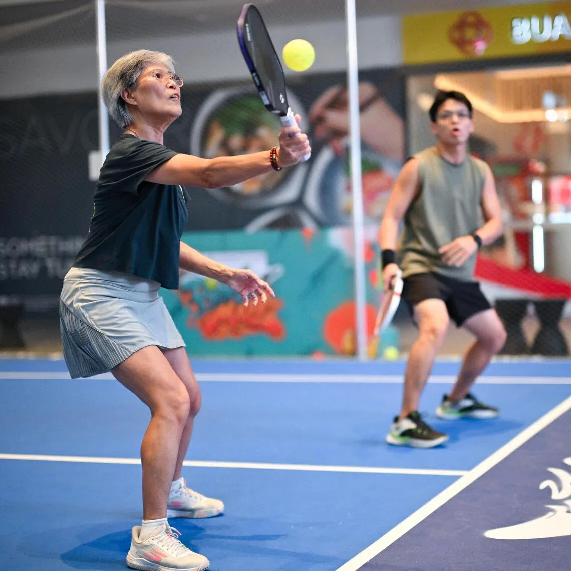 Retiree Elaine Yong (left) started playing pickleball in 1996.