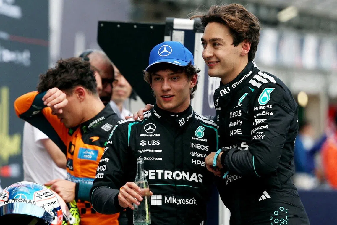 Formula One F1 - Australian Grand Prix - Albert Park Grand Prix Circuit, Melbourne, Australia - March 7, 2026 Mercedes' George Russell celebrates after qualifying in pole position with second place Mercedes' Andrea Kimi Antonelli REUTERS/Hollie Adams