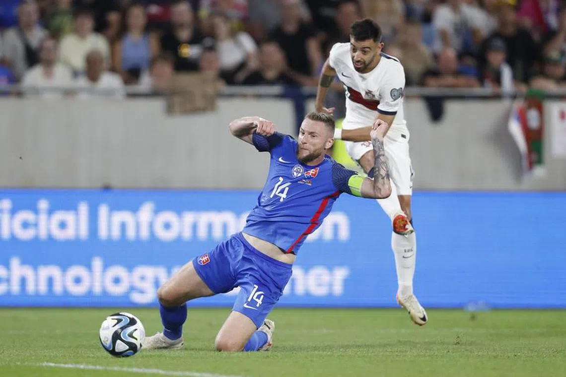 Soccer Football - Euro 2024 Qualifier - Group J - Slovakia v Portugal - Tehelne pole, Bratislava, Slovakia - September 8, 2023 Portugal's Bruno Fernandes scores their first goal REUTERS/David W Cerny