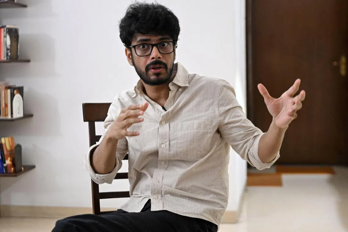 This photograph taken on August 12, 2026 shows Oscar-nominated Indian filmmaker Shaunak Sen speaking during a interview with AFP at his residence in New Delhi. Sen's new documentary "All That Breathes", began as a "coping" mechanism after a shock cancer diagnosis, but continues the motifs of environmental degradation and caregiving that drove his previous work. (Photo by Arun SANKAR / AFP)