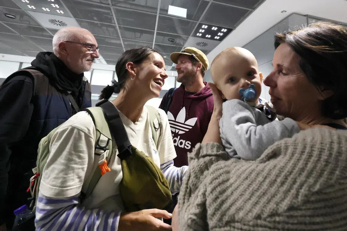 Members of a German family arriving in Frankfurt, Germany, on March 3, after fleeing Dubai.