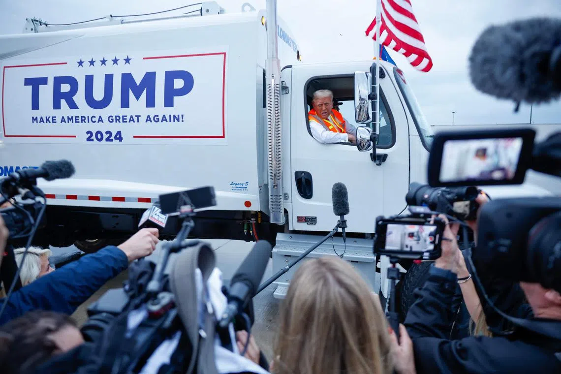 GREEN BAY, WISCONSIN - OCTOBER 30: Republican presidential nominee, former President Donald Trump holds a press conference from inside trash hauler at Green Bay Austin Straubel International Airport on October 30, 2024 in Green Bay, Wisconsin. With less than a week until Election Day, Trump is campaigning for re-election in the battleground states of North Carolina and Wisconsin.   Chip Somodevilla/Getty Images/AFP (Photo by CHIP SOMODEVILLA / GETTY IMAGES NORTH AMERICA / Getty Images via AFP)