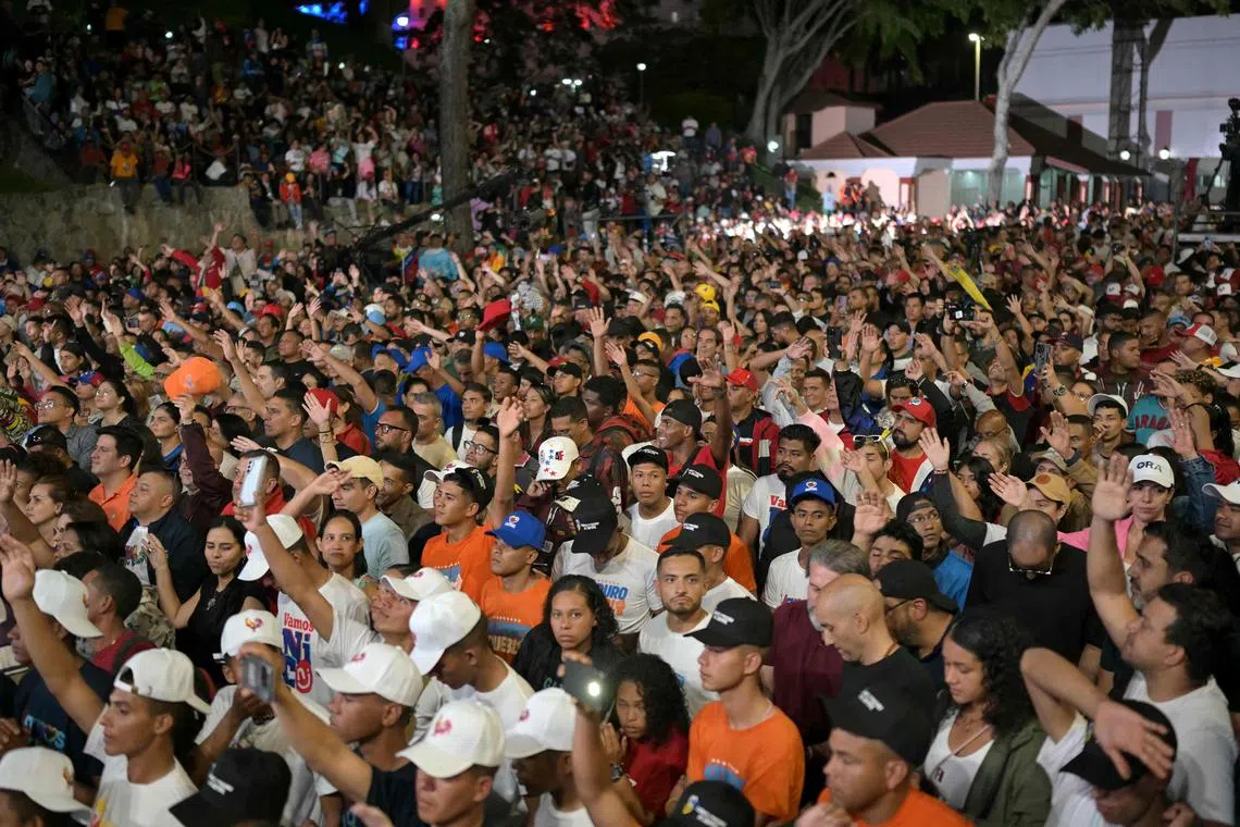 Supporters of Venezuelan President and presidential candidate Nicolas Maduro wait for the first results of the presidential election.
