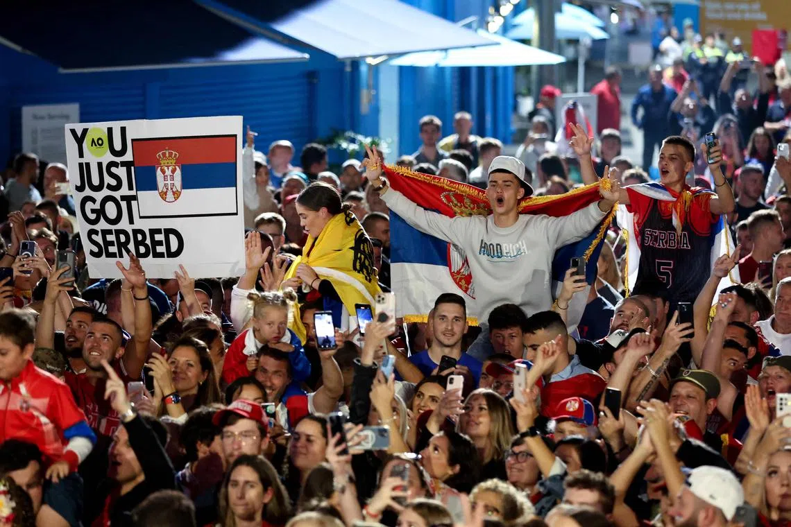 Spectators celebrating after Novak Djokovic won the Australian Open, in Melbourne, Australia, on Jan 29, 2023.