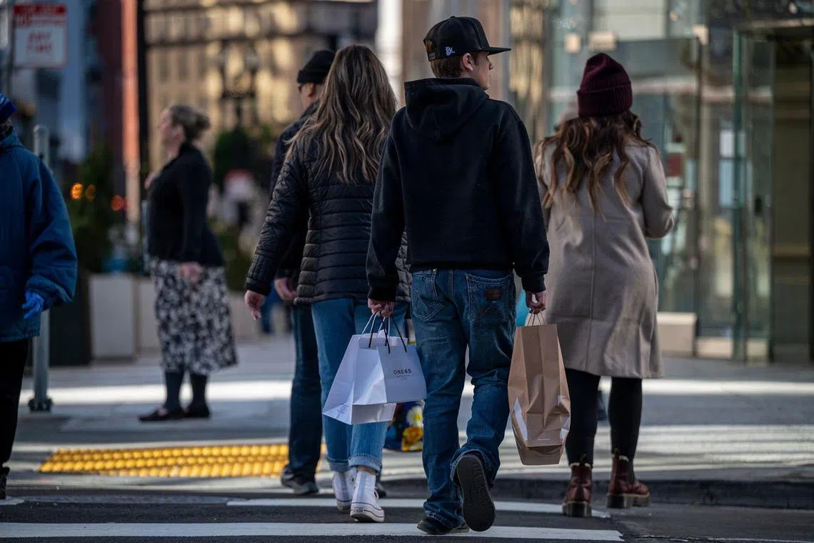 Shoppers on Geary Street in San Francisco, California, US, on Tuesday, Nov, 29, 2022. US retailers eked out modest growth over Black Friday weekend with deep discounts that lured shoppers seeking a reprieve from stubborn inflation. Photographer: David Paul Morris/Bloomberg