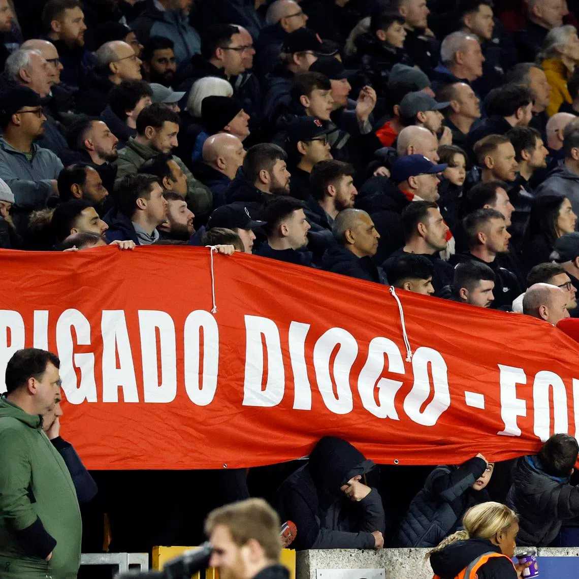 Soccer Football - Premier League - Wolverhampton Wanderers v Liverpool - Molineux Stadium, Wolverhampton, Britain - March 3, 2026 Liverpool fans with a banner for former Liverpool player Diogo Jota Action Images via Reuters/Peter Cziborra/File Photo