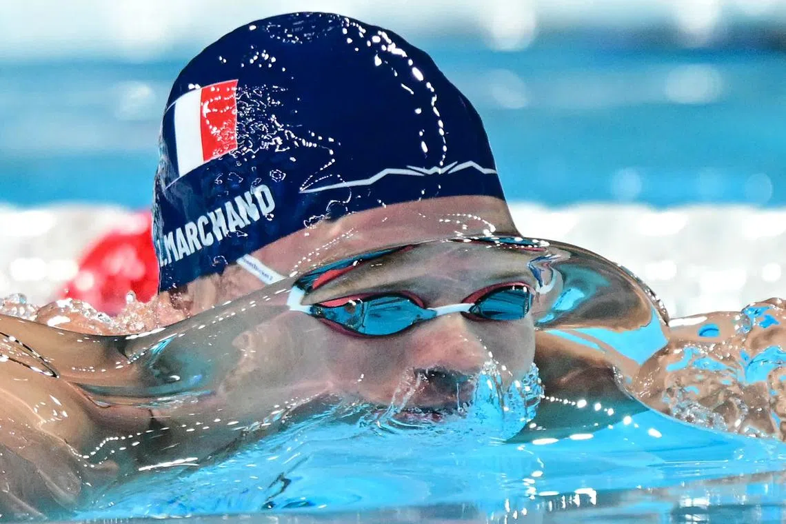 France's Leon Marchand competing in a heat of the men's 200m breaststroke swimming event, during the Paris 2024 Olympic Games, at the Paris La Defense Arena in Nanterre, west of Paris, on July 30, 2024. 
