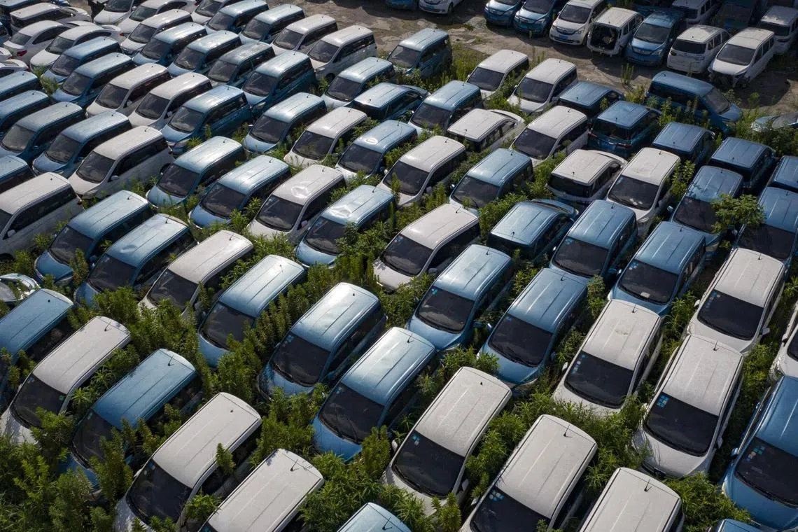 Bloomberg Best of the Year 2023: A lot holding decommissioned electric vehicles in Hangzhou, China, on Monday, July 31, 2023. Photographer: Qilai Shen/Bloomberg