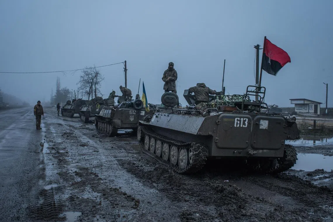 Ukrainian soldiers who had been fighting in the Kherson region head away from the front to rest and repair vehicles, on Dec 9, 2022.
